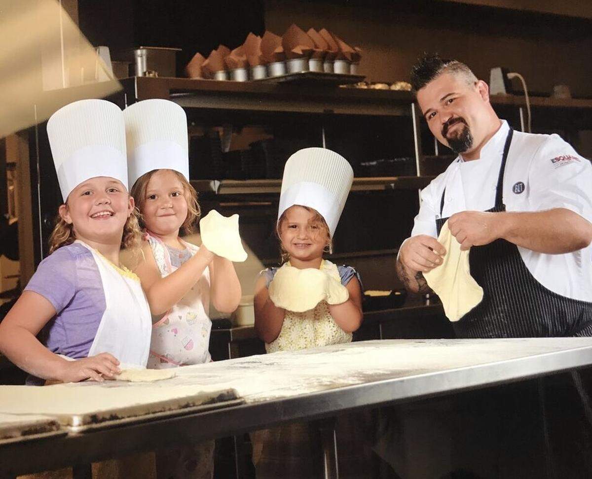 Chef Dustin Ward with daughters (left-to-right) Dahlia, Remi and Caden spend family time in the kitchen.