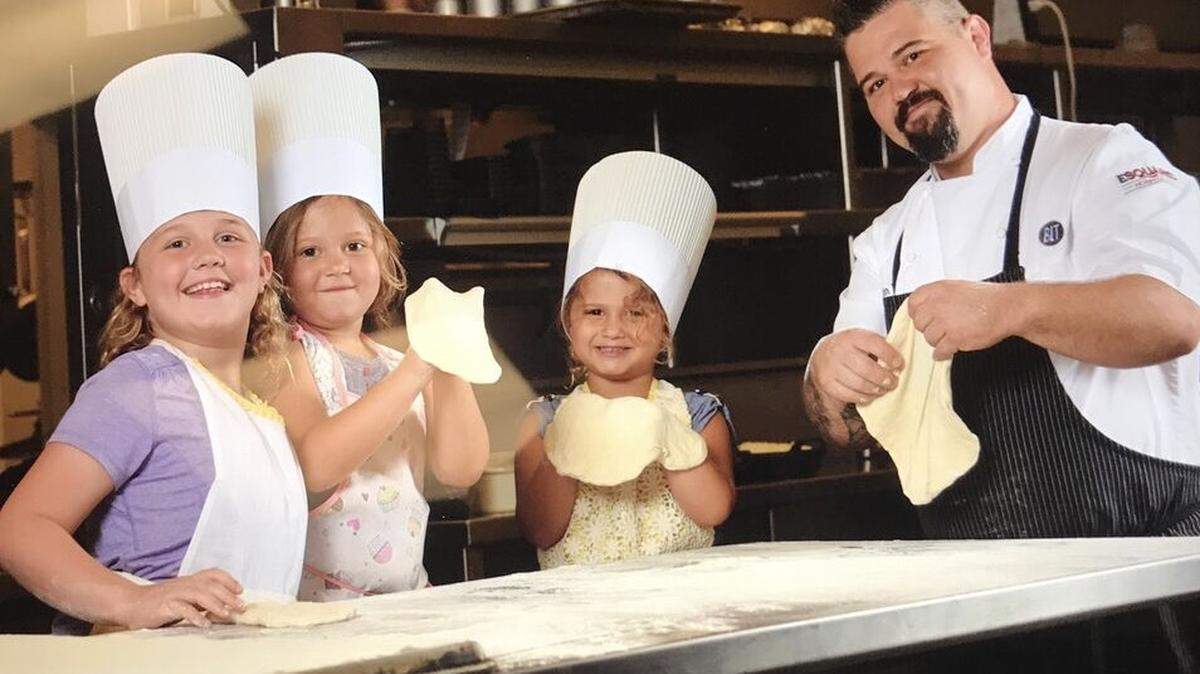 Chef Dustin Ward with daughters (left-to-right) Dahlia, Remi and Caden spend family time in the kitchen.