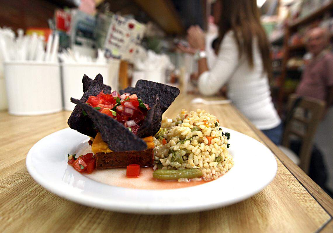 Vegetarian - A Tres amigos plates (red beans mashed with sweet potatoes and plantains, blue corn tortillas and Tomatoes in a cilantro sauce), made by chef -owner Carlos Schicchi, at the Beehive Juice Bar, vegan restaurant in Coral Gables. March Tuesday 22, 2011.
