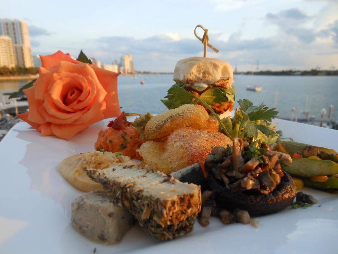 A vegan slider with an assortment of nut-milk cheese and hummus on the terrace of Full Bloom in Miami Beach.