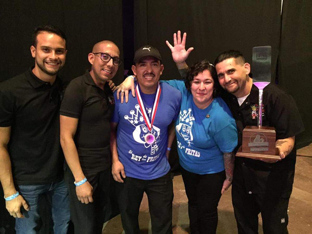The team from El Rey de las Fritas was judged to have the best frita (Cuban hamburger) at Croquetapalooza on Aug. 25.