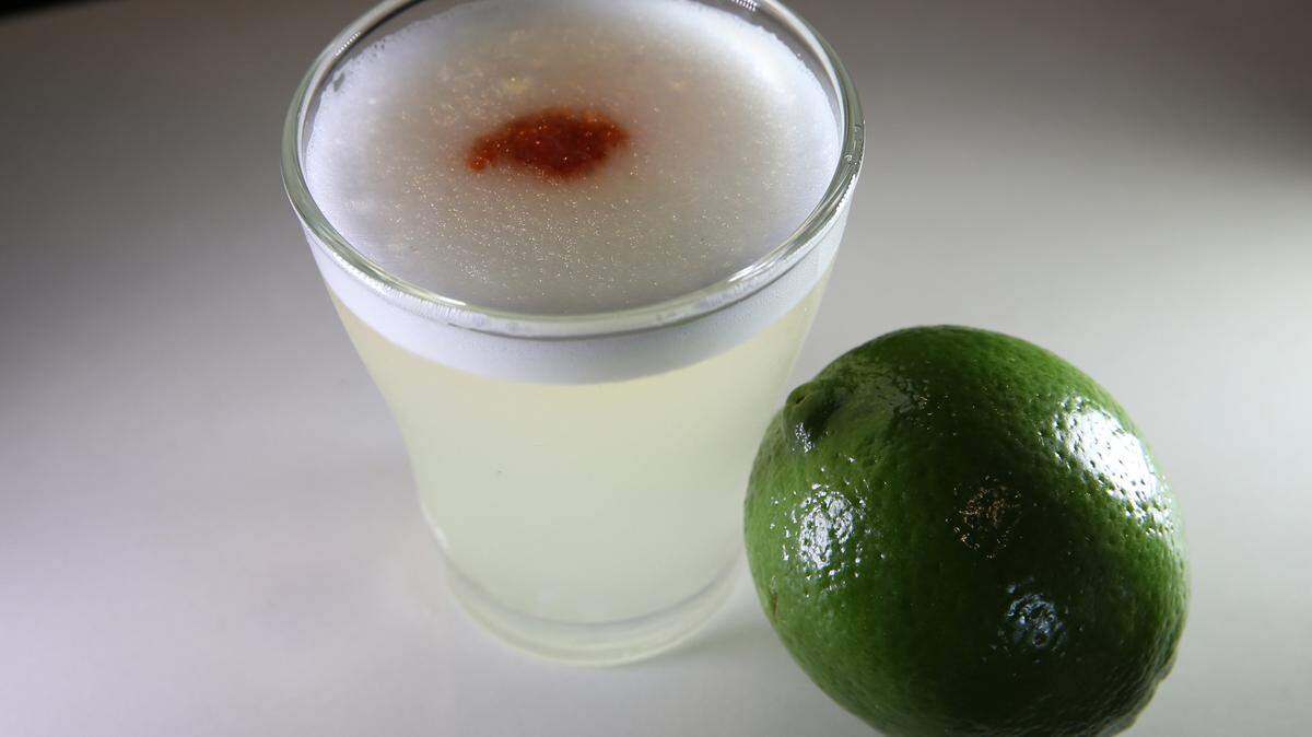 Pisco Sour drink prepared by Dr. Limon Ceviche Bar.
