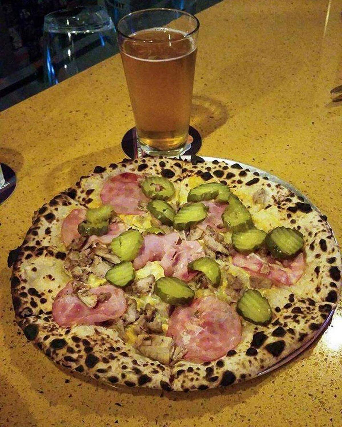 Paulie Gee’s likes to use local flavors in their pizzas. This Jewbano pizza mimics the flavors of a Cuban sandwich with pulled pork, Canadian bacon, Swiss cheese, yellow mustard and kosher dill pickle slices.