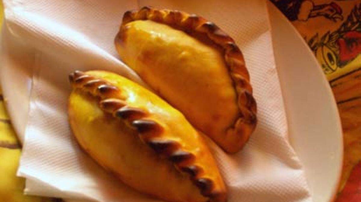 Baked or fried, with meat or con guava, South Florida's empanadas are half-moons of heaven. Photo: Linda Bladholm