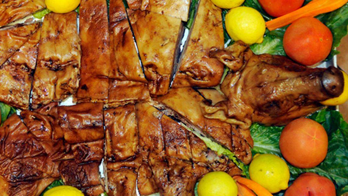 Chef Felipe Perez, at Jamon, Jamon, Jamon located at 10 SW South River Dr, show's off one of the favorit dishes which is "Cochinillo" a young roasted pig.