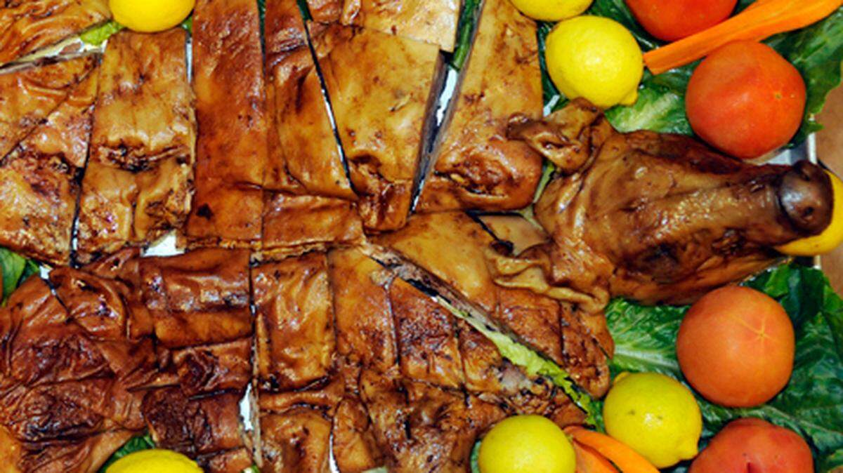 Chef Felipe Perez, at Jamon, Jamon, Jamon located at 10 SW South River Dr, show's off one of the favorit dishes which is "Cochinillo" a young roasted pig.