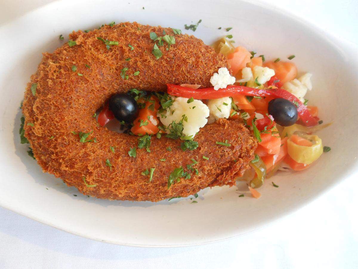 Alheira, a type of smoked ground chicken sausage seasoned with garlic, saffron and paprika from Old Lisbon.