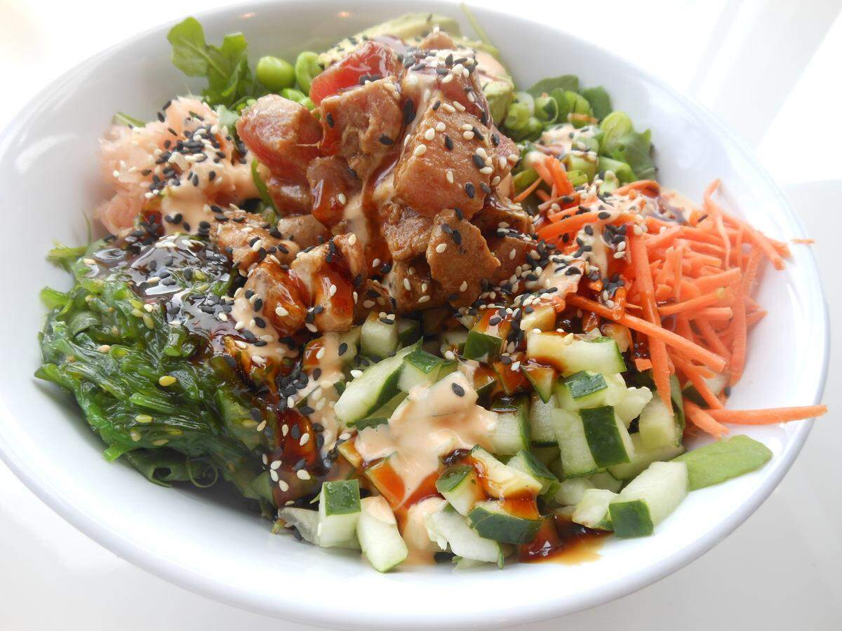 Poke bowl with ahi tuna, sesame seeds, seaweed, edamame, cucumber and carrot at Carrot Express.