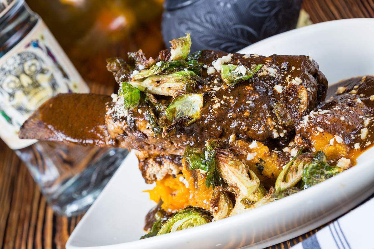 The chichilo, a short rib smothered in painstakingly created charred black molé, is slow cooked for six hours.