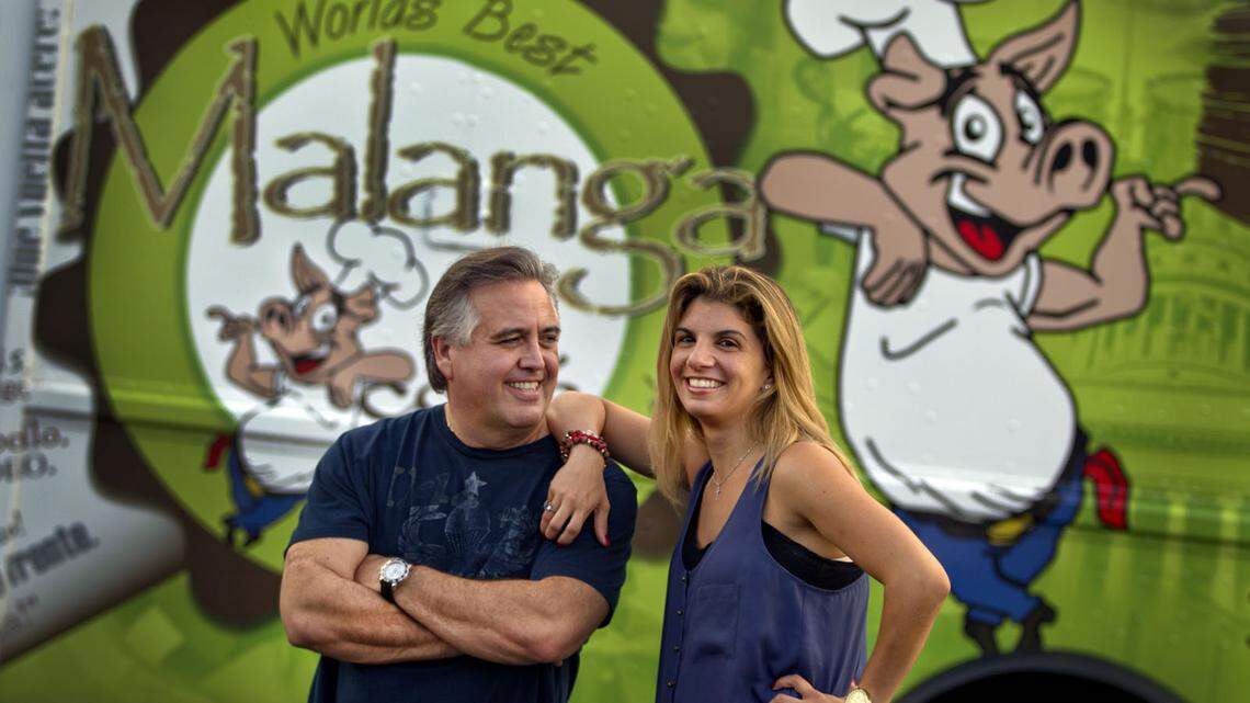 PINECREST: Malanga Cafe owners Tony and Melissa Vias pose in front of their new food truck.