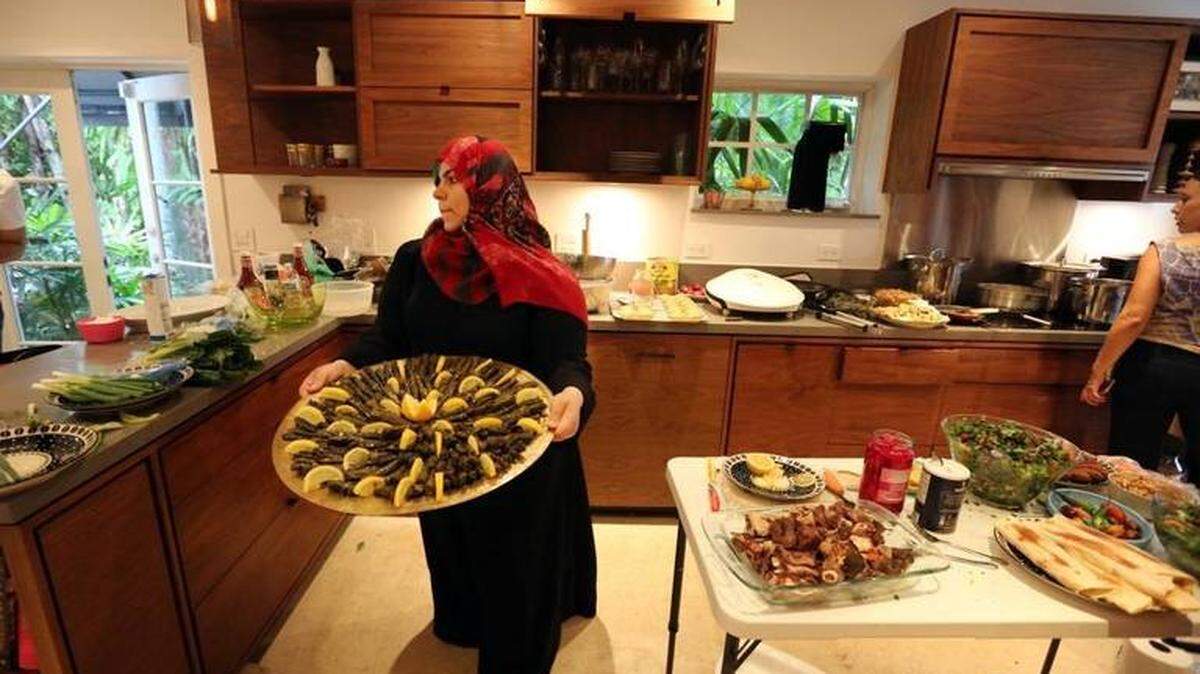 Syrian refugee families who have been relocated to South Florida are teaming up with a fundraising group that uses home-cooked meals to help them financially and socially as they adapt. The refugee women take turns cooking homemade Syrian delights and then enjoying the food and conversation along with the Syrian Supper Club of South Florida participants.