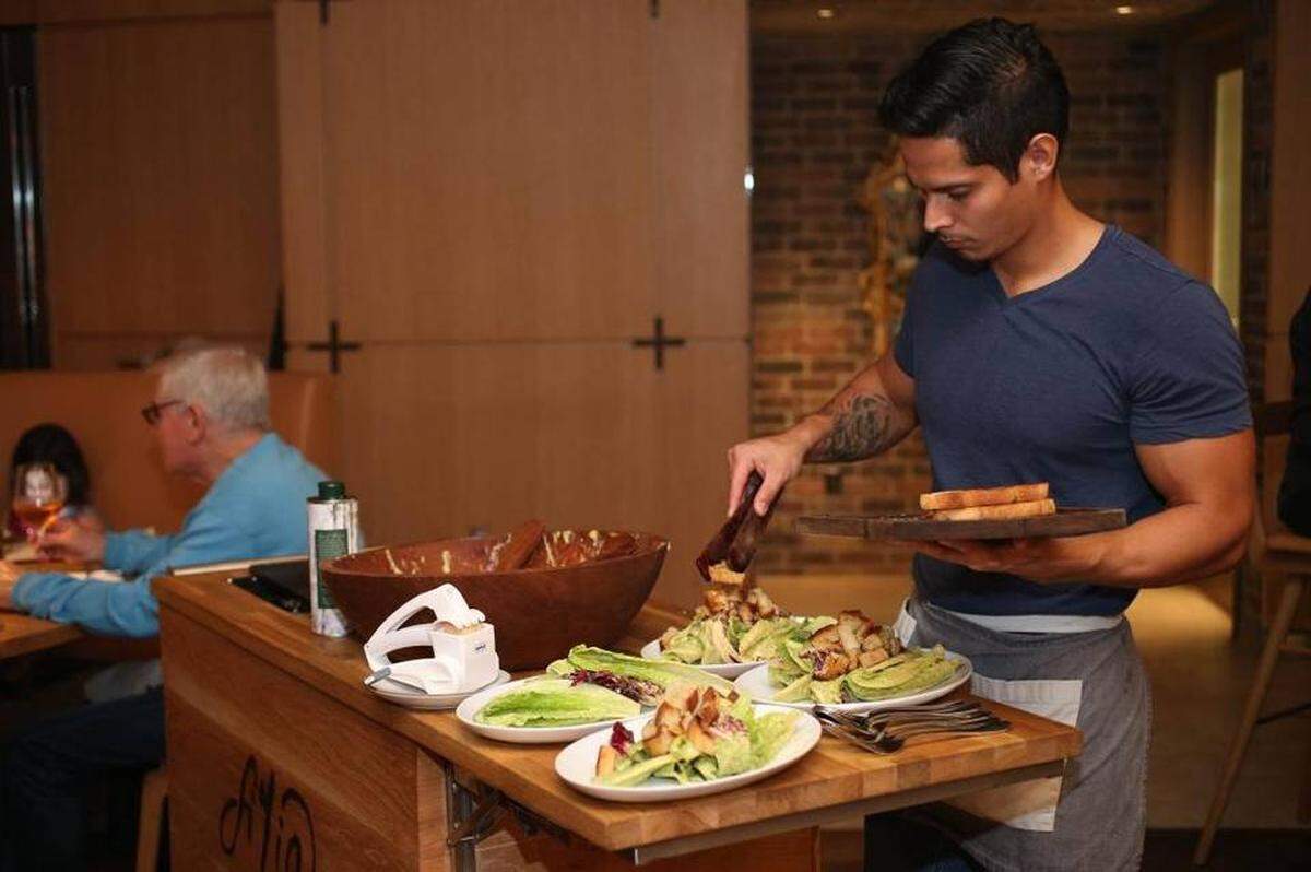 Fi’lia tricked out a pair of tableside carts, which are wheeled around the restaurant so friendly fellows can put on a tightly choreographed show of making your Cesar salad to order. Handout