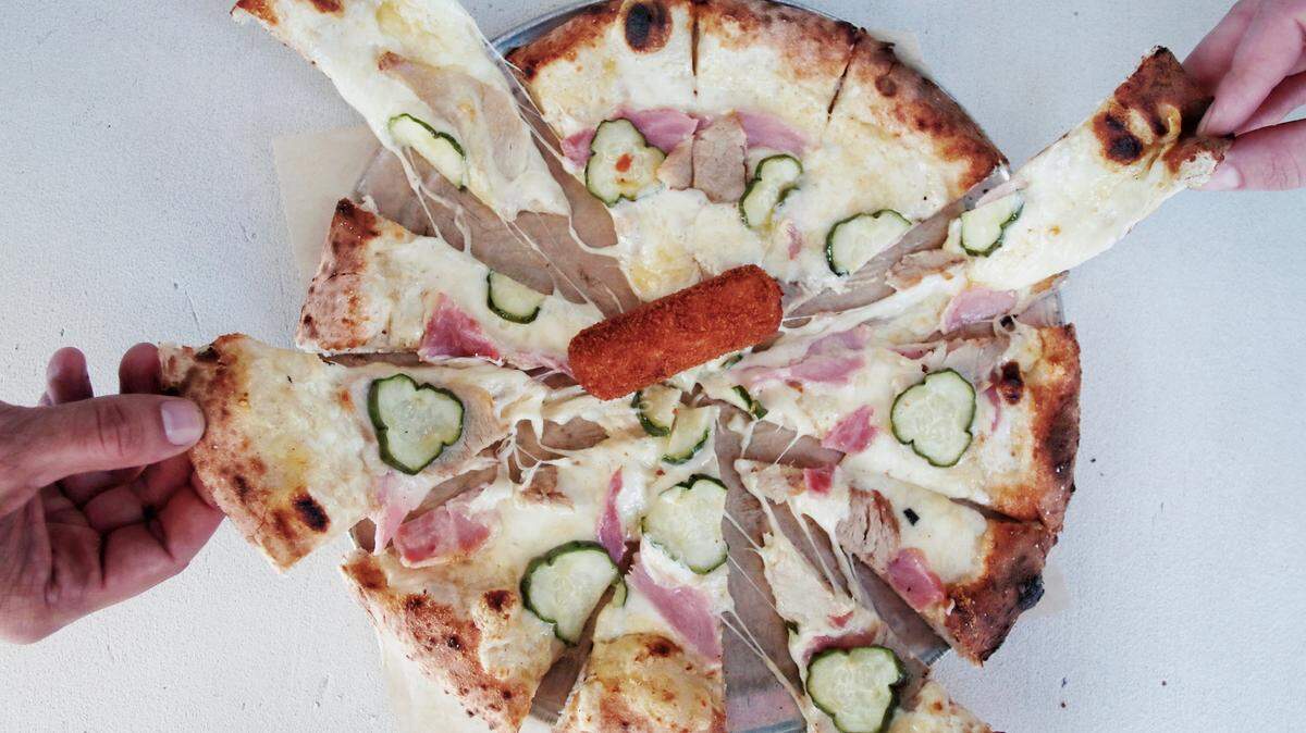 Versailles Cuban restaurant has teamed with restaurateur Michael Schwartz to create a Cuban sandwich pizza.