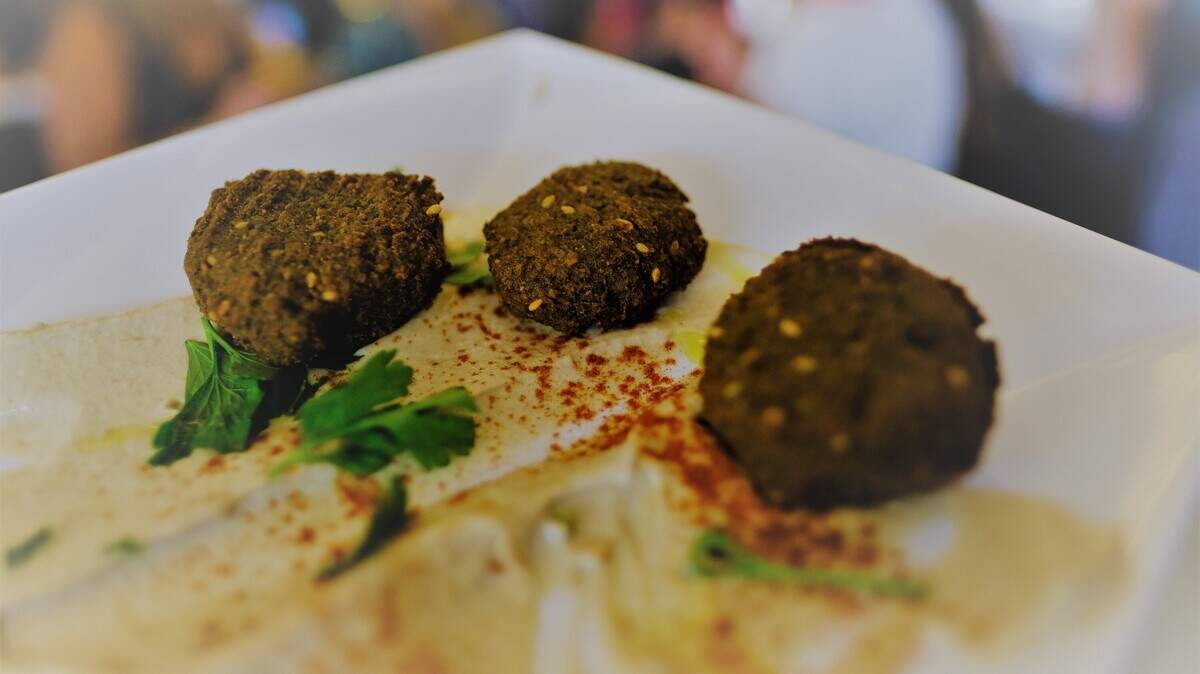 A Falafel platter with a side of Pita bread from the Oriental Bakery &amp; Grocery. Photo: Nissa Benjamin.<!-- end forecolor -->