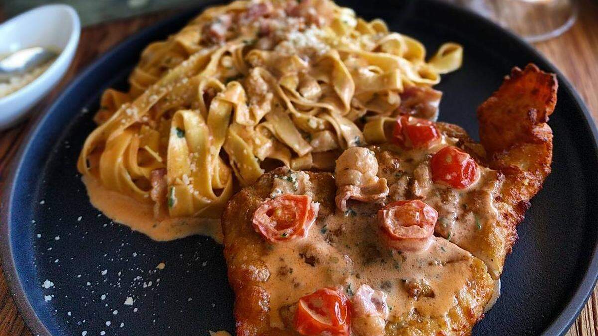 Fetuccini a la vodka with bacon, cherry tomatoes and lightly breaded chicken at Mazzi Cucina