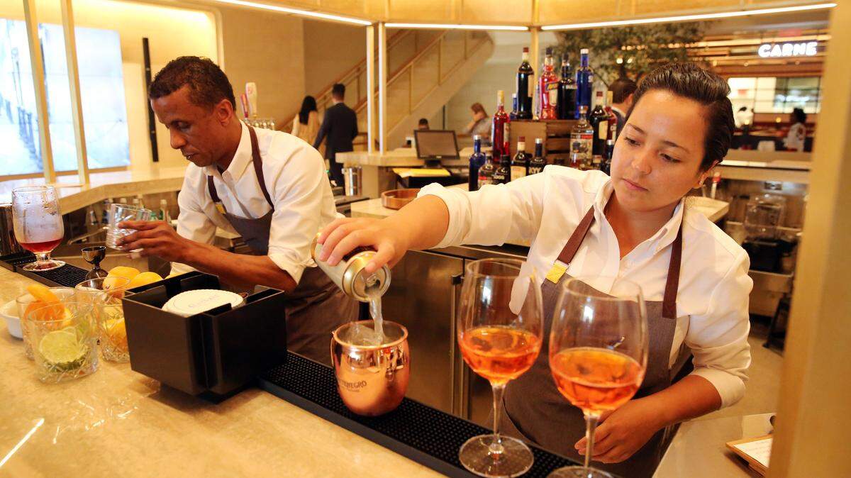 Bartenders Rozano Johnson and Juana Pineda serve up cocktails at the Aperitivo Bar located on the second level of Brickell City Centre’s La Centrale.