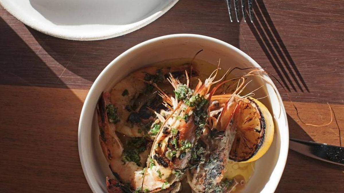 The excellent wood-fired Florida prawns are one of the few local seafood items on Upland Miami’s vast menu.