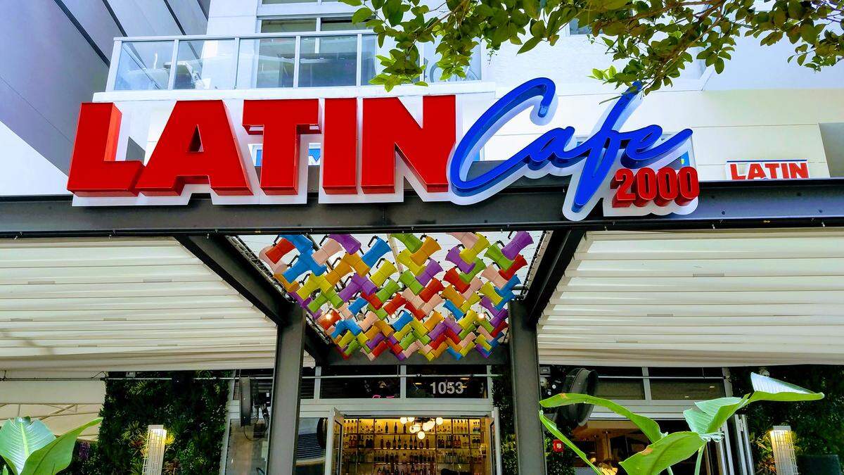 One hundred colorful cafeteras hang at the entrance of the new Latin Cafe in Brickell.