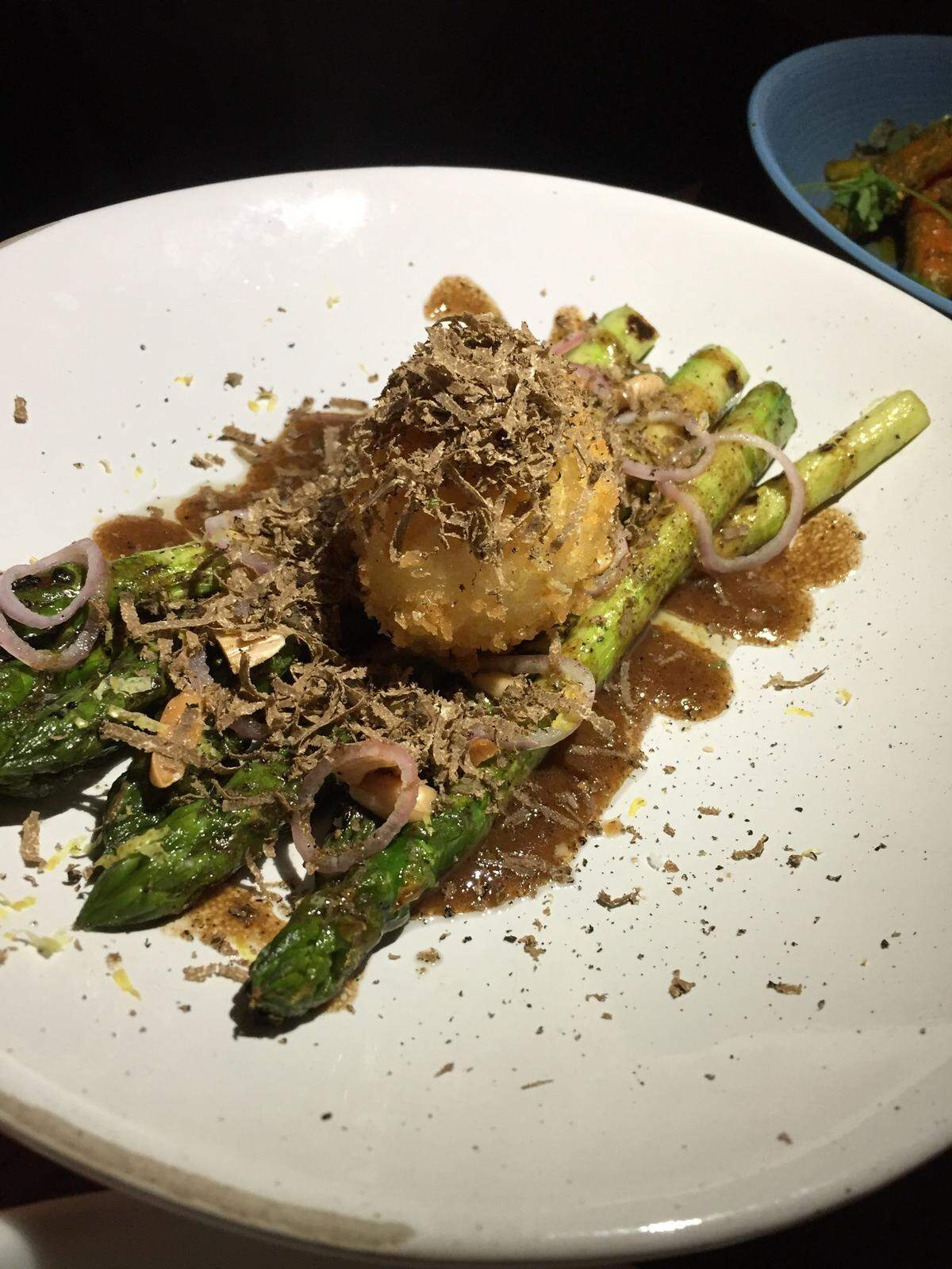 Charred asparagus with poached truffle egg at The Jim and Neesie.