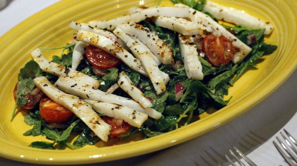 Calamari alla griglia (calamari with baby arugula, onions and cherry tomatoes in a lemon mustard sauce) is shown at Aldo Restaurant &amp; Bar, 1917 Hollywood Blvd., Hollywood. Chef owner Aldo Vespero is a native of Napoli, Italy. Photo by Marsha Halper.