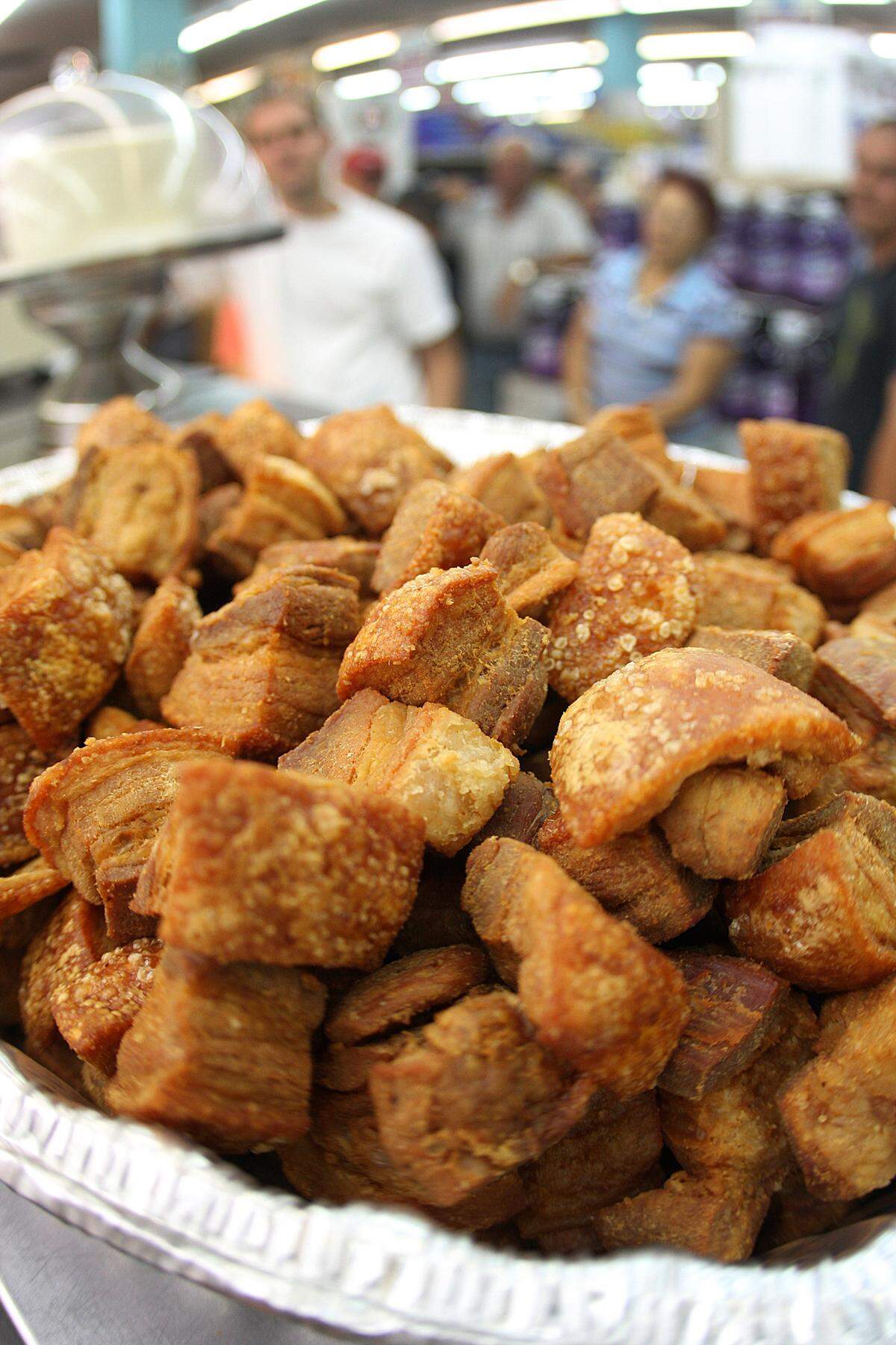 Chicharrones, fried pork rinds available at $5.49 per pound, are ready to eat at La Bodega Bestway Supermarket on Flagler Street on Monday, July 5, 2010.
