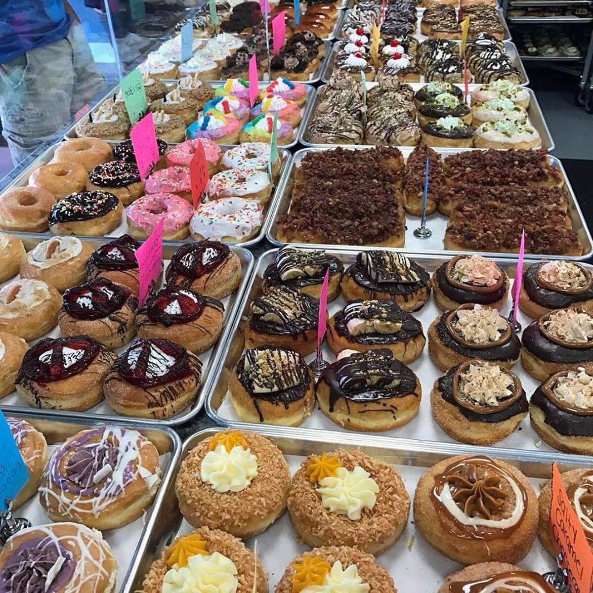 A rainbow of colors and choices at Mojo Donut will make your head spin. (Facebook)