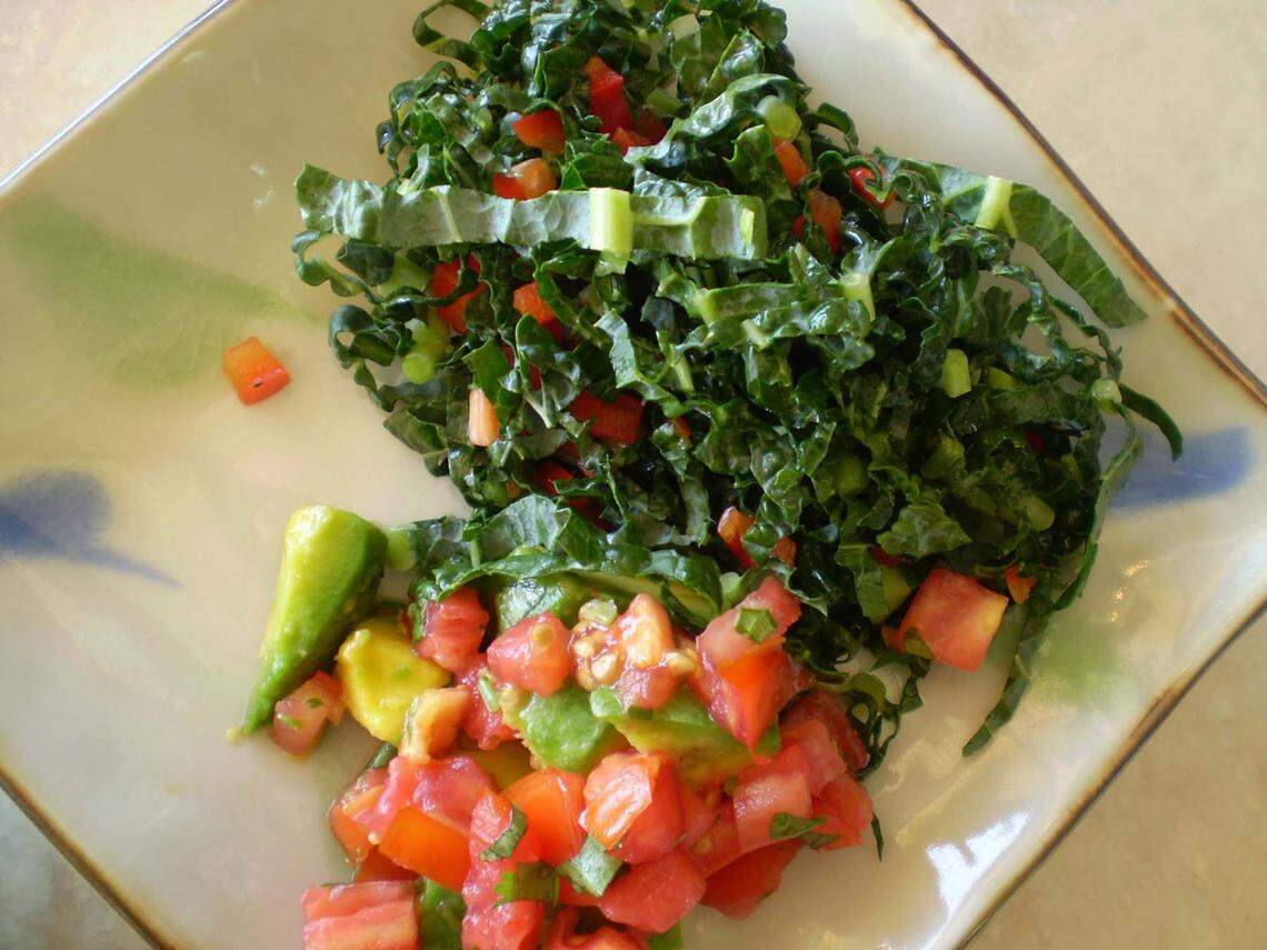 Raw kale shreds and avocado and tomato salad served at the Honey Tree, a health food store on Biscayne near 51st that also sells vegetarian fare for lunch.