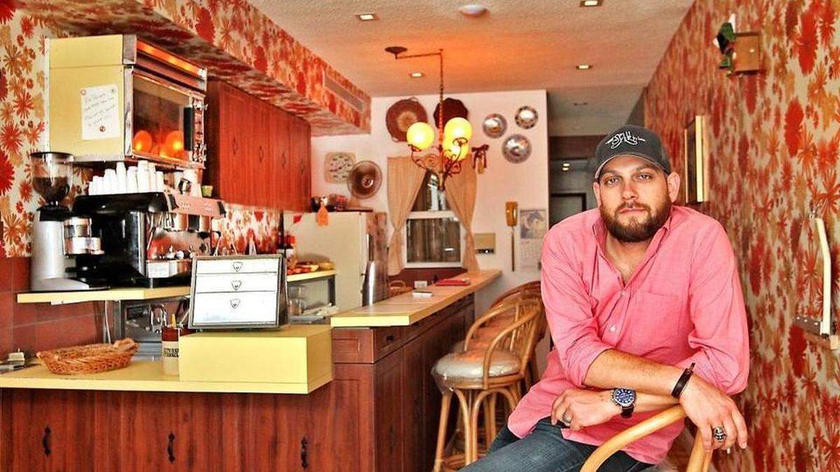 Matt Kuscher sits near the front of his new Coconut Grove concept Vicky's House on Thursday, April 13, 2017. Kuscher has made a career out of creating very put-together dining concepts and Vicky's House a milkshake shop is his latest.
