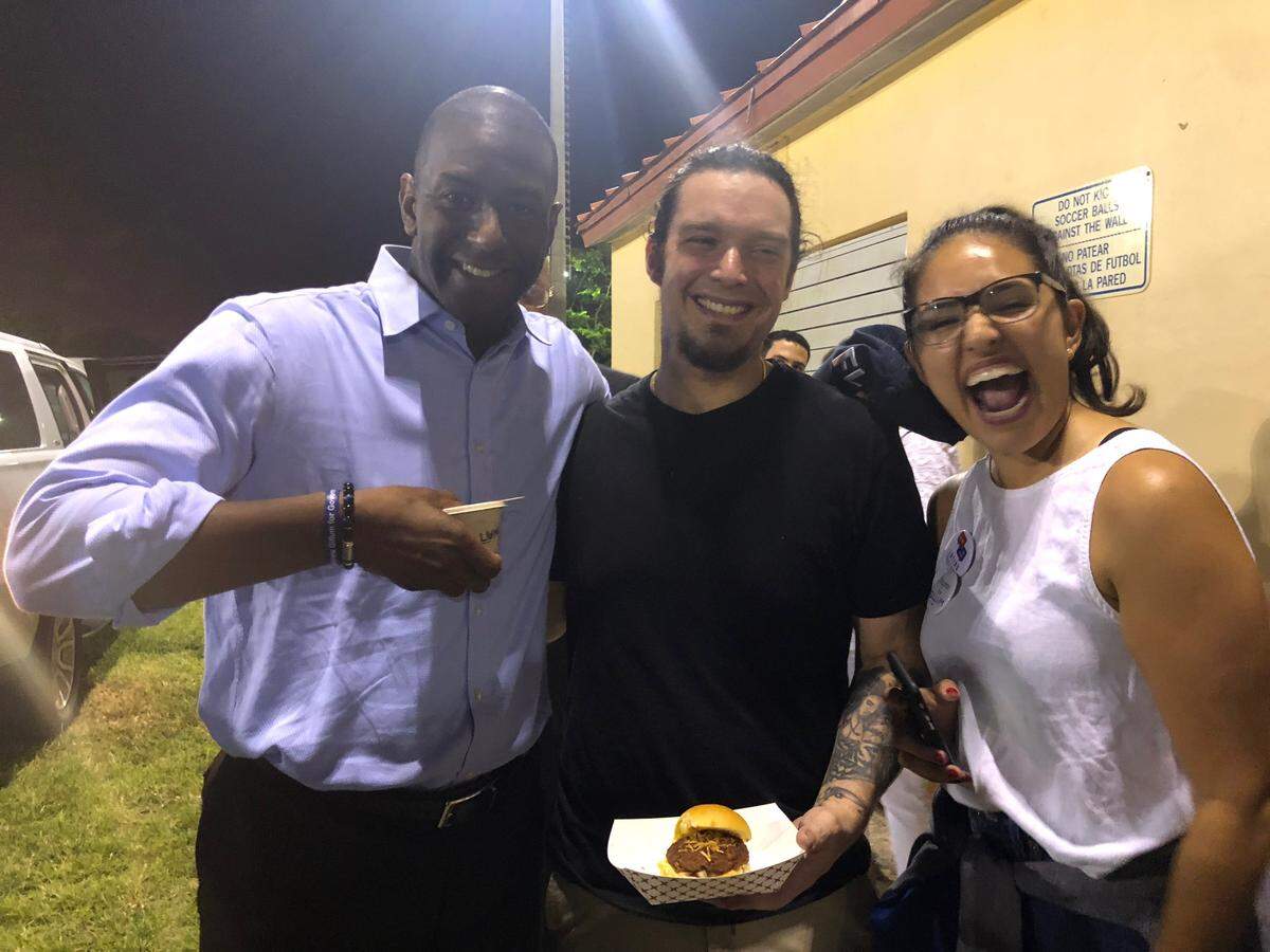 Ariete chef Micheal Beltran (center) served fritas at an event Nov. 4 at Shenandoah Park for Florida gubernatorial hopeful Andrew Gillum. Luisa “Lulu” Santos of Lulu's Ice Cream served her sweet treats.