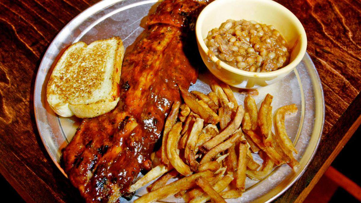 Rib plate $15.95, from Rock n Roll Ribs in Coral Springs. The restraunt was open by Nicko McBain, former drummer of Iron Madien, the rock group.