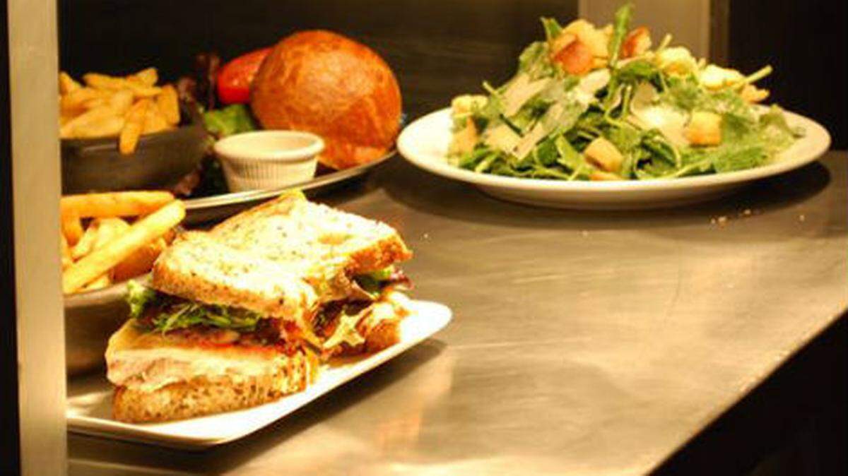 Food comes out of the kitchen during Tap 79's first night of service in Miami's Shorecrest neighborhood.