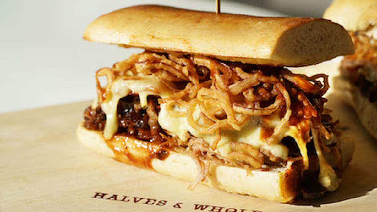 The Stack (roasted pork, short rib, bacon) is among the sandwiches at the new Halves &amp; Wholes.