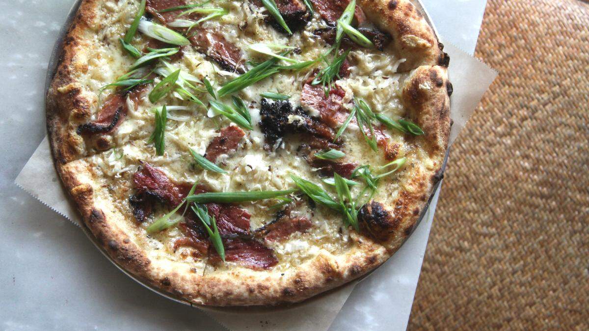 Michael Schwartz's Harry's Pizzeria will used Katz's Delicatessen's pastrami at all locations through July 23. Katz owner Jake Dell will be in town July 18 to learn how to make the pizza.