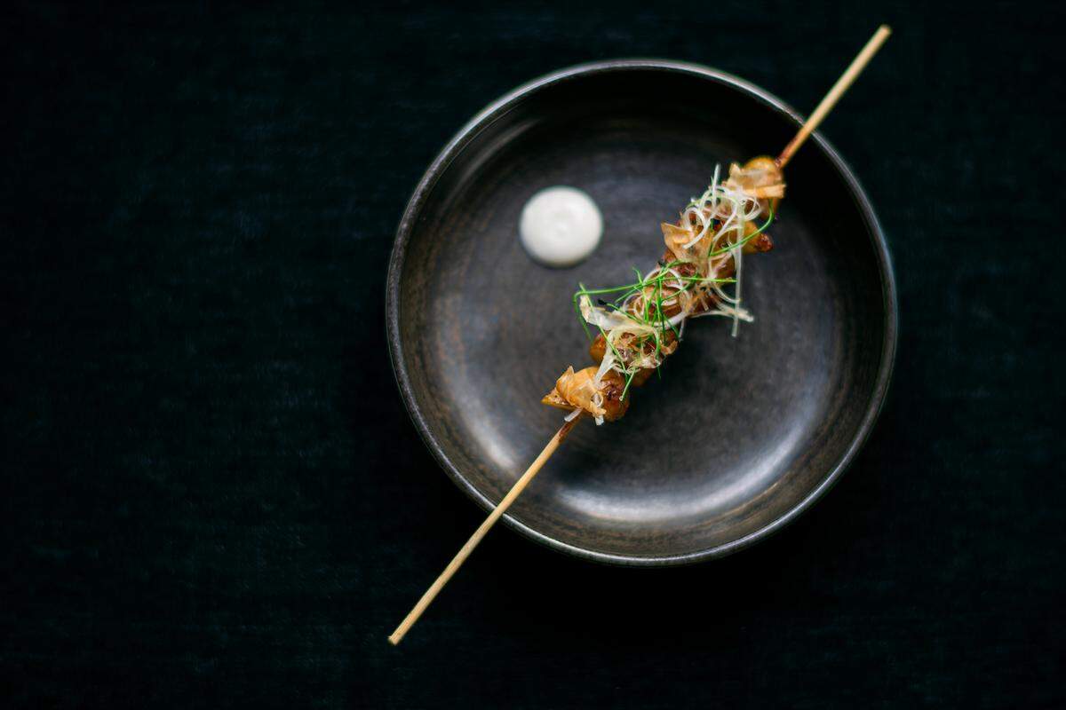 Grilled potato robatayaki in truffle cream with bonito at Kaido