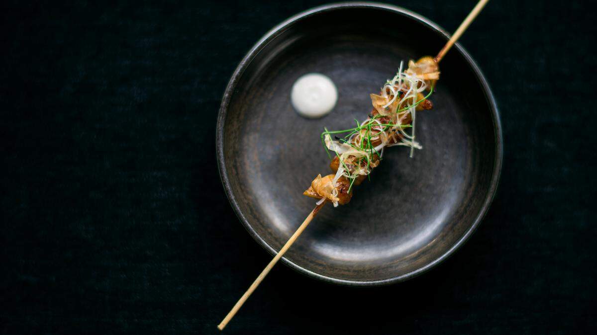Grilled potato robatayaki in truffle cream with bonito at Kaido