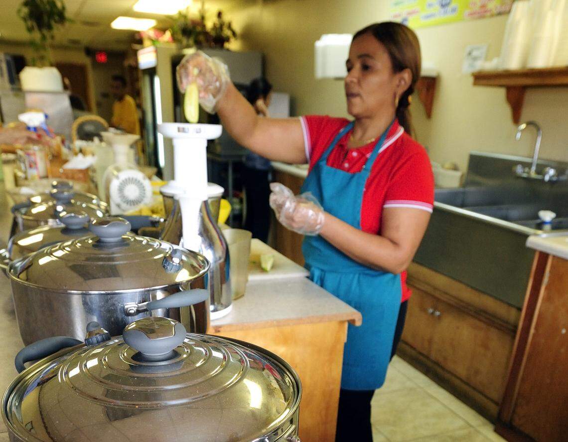 Marisol Sanchez squeezes pineapple juice at Vegan and Juice deli and juice bar, Monday, Oct. 24, 2011, in Sweetwater. Located at 115 S.W. 107 Ave., the restaurant offers a variety of vegan and vegetarian dishes on an approximately weekly rotation.
