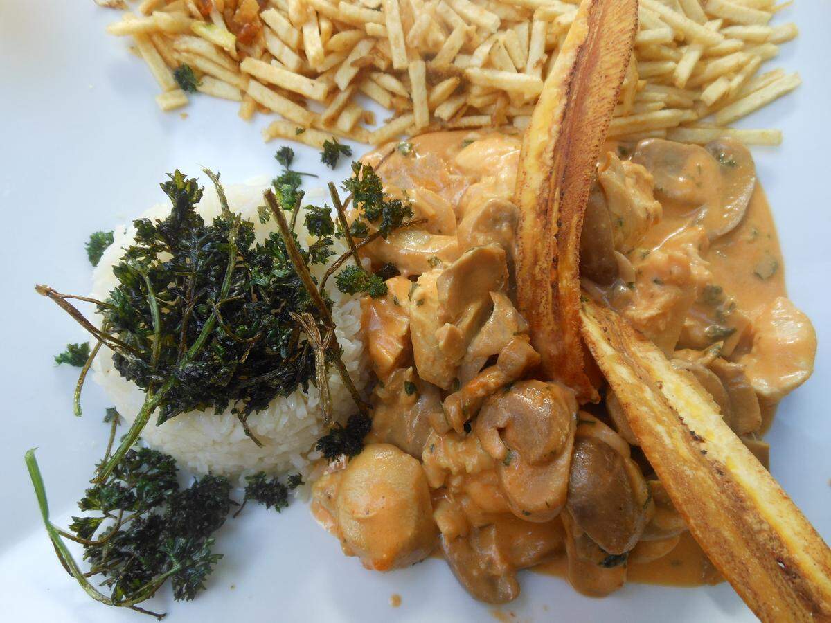 Chicken stroganoff with potato sticks at Boteca Copacabana on Espanola Way in Miami Beach.