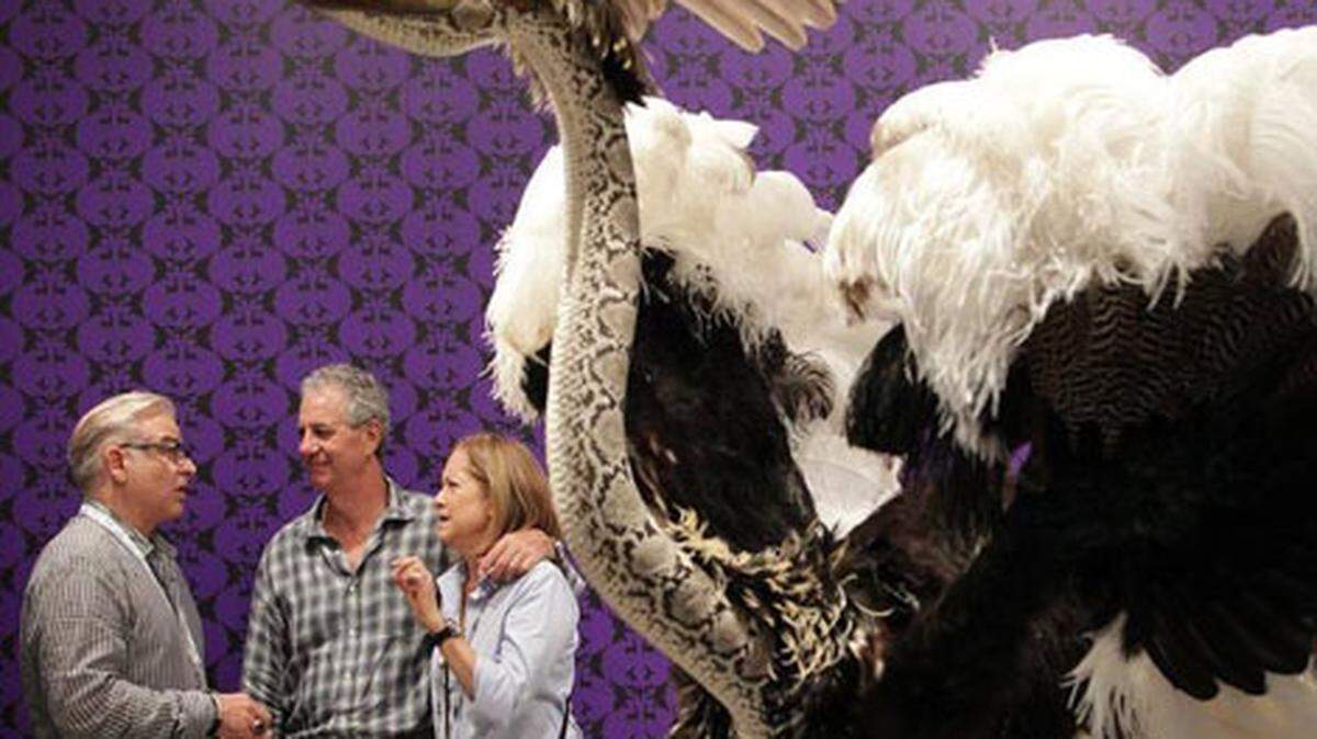 Artist Enrique Gomez de Molina, left, chats about his piece "Showgirl" at Art Miami 2015. Photo: Carl Juste.