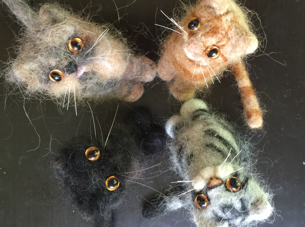 An assortment of cat "meowmorials" via ninelivestwine.com