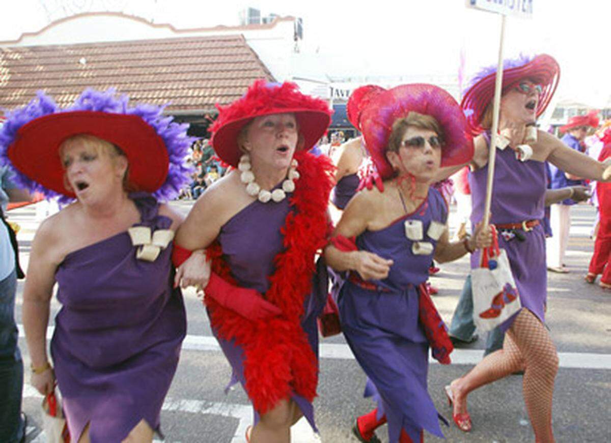 Blowing the year at giant raspberry at the 2006 King Mango Strut. Photo: Roberto Koltun/Miami.com staff