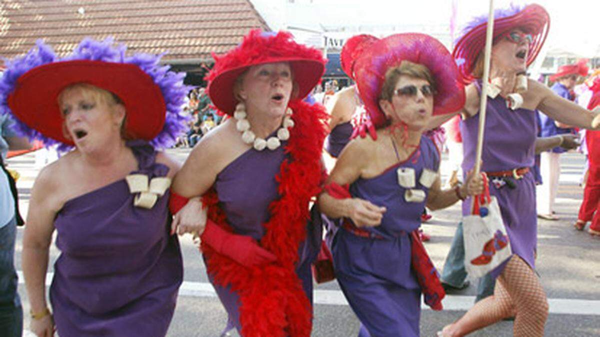 Blowing the year at giant raspberry at the 2006 King Mango Strut. Photo: Roberto Koltun/Miami.com staff