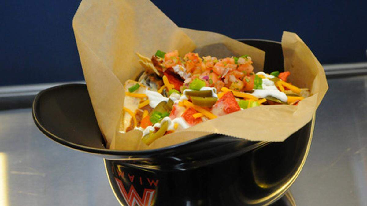 Helmet nachos ($15): We’d cheer for these tasty chips, topped with pico de gallo, shredded cheddar, scallions and Levy Restaurants (the concession czar here) own chipotle cheese sauce (lighter than the usual yellow goop), served in a souvenir helmet.