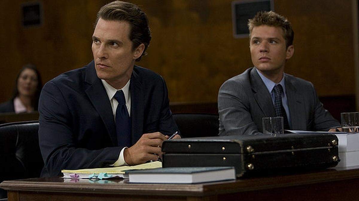 A lawyer again: Matthew McConaughey, left, with Ryan Phillippe, is all dressed up in 'The Lincoln Lawyer.'
