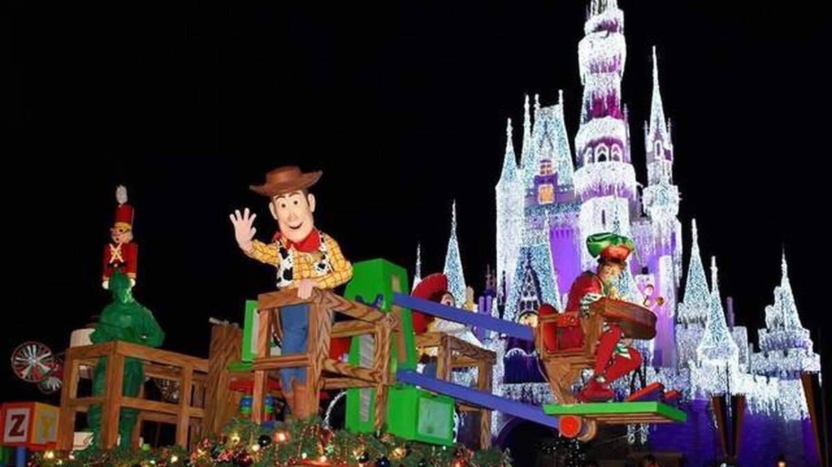 Woody and his “Toy Story” pals wave to Magic Kingdom guests during “Mickey’s Once Upon a Christmastime Parade.” Todd Anderson - Walt Disney World Resort