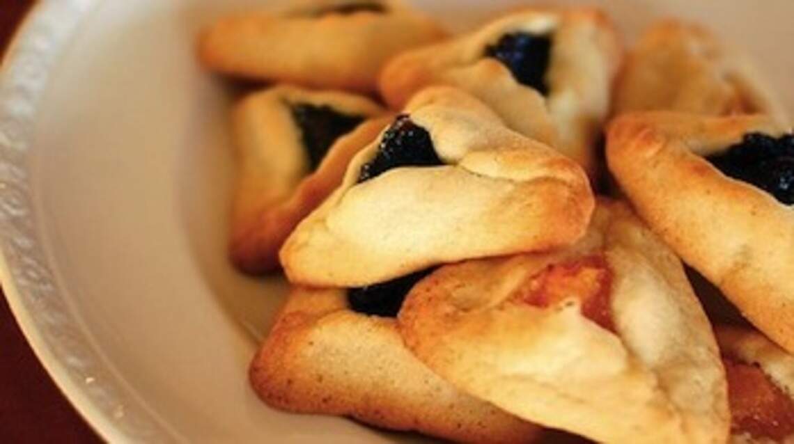 Purim, the Jewish Mardi Gras, when all is topsy-turvy — and we eat the bad guy’s hat