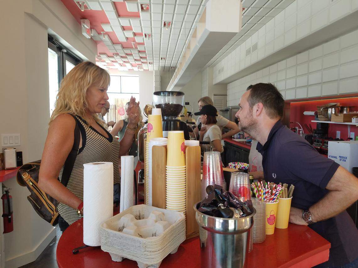 Michal Aviv places an order at Cafe Creme.