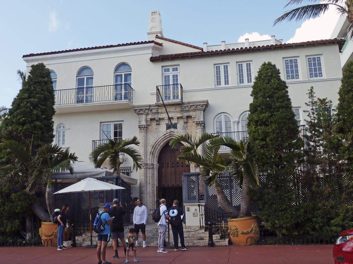 Posing for photographs outside the former Versace mansion is a time honored Miami tradition.