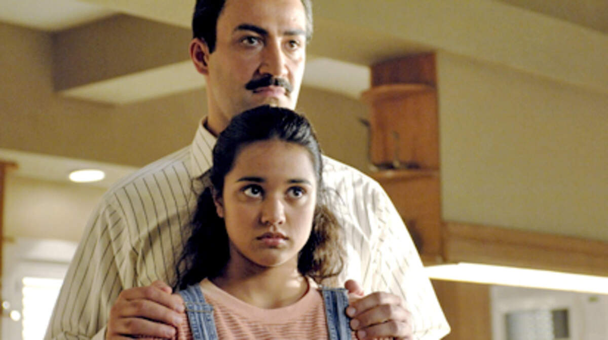 Peter Macdissi and Summer Bishil are shown in a scene from, "Towelhead." Photo: Dale Robinette.
