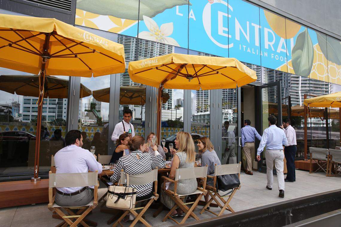 People attending a preview event at Brickell City Centre for a first look (and taste) of La Centrale, toast as they sit down to lunch on the patio seating off of the first floor Mercato on Wednesday afternoon, Feb. 7, 2018. La Centrle's grand opening for the public will be on Feb. 16.