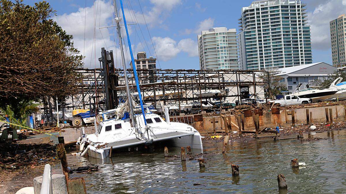 A sunken catamaran is seen at Grove Key Marina, after Hurricane Irma passed over South Florida, on September 12, 2017.